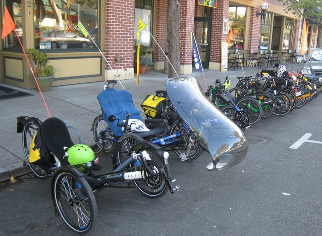 [photo: group of parked recumbent tricycles]